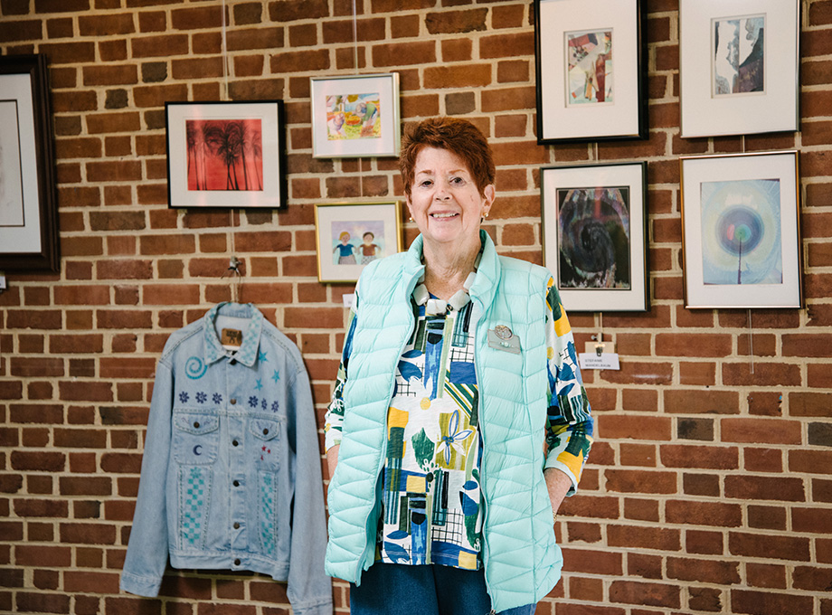 woman smiling in Meadow Lakes common area