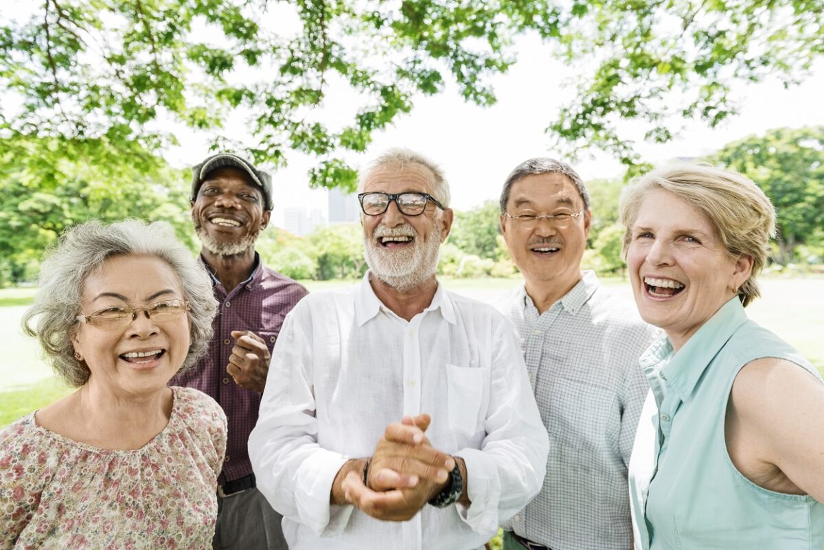 Happy seniors posing for a picture at a retirement community