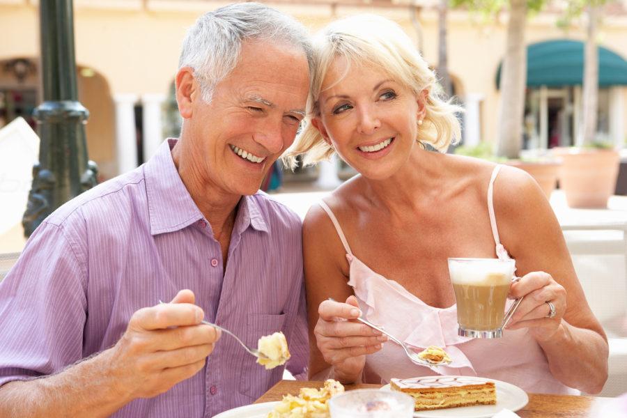 A happy senior couple enjoying independent living with a healthy brunch.