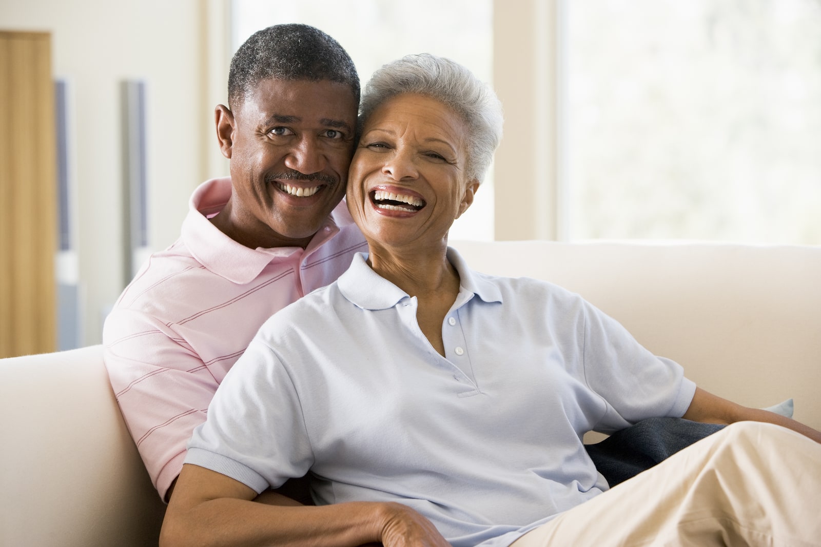 Senior_Living_Security_ML Happy senior couple feeling safe in their home.