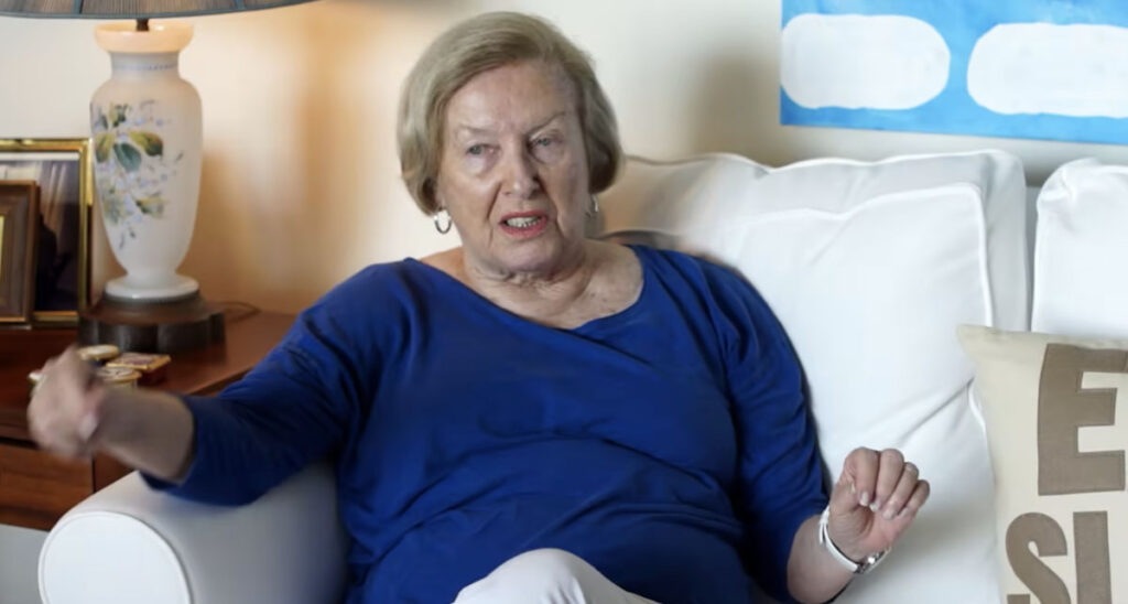 senior woman in blue sweater