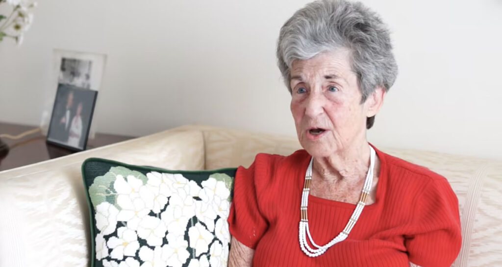 senior woman in red blouse