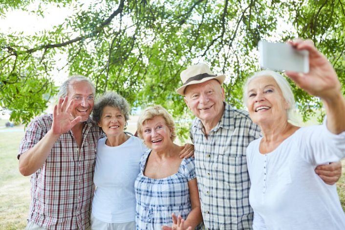 Group of happy seniors living in an independent living community.