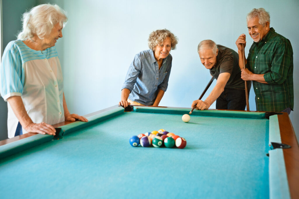 Senior Playing Pool at Community
