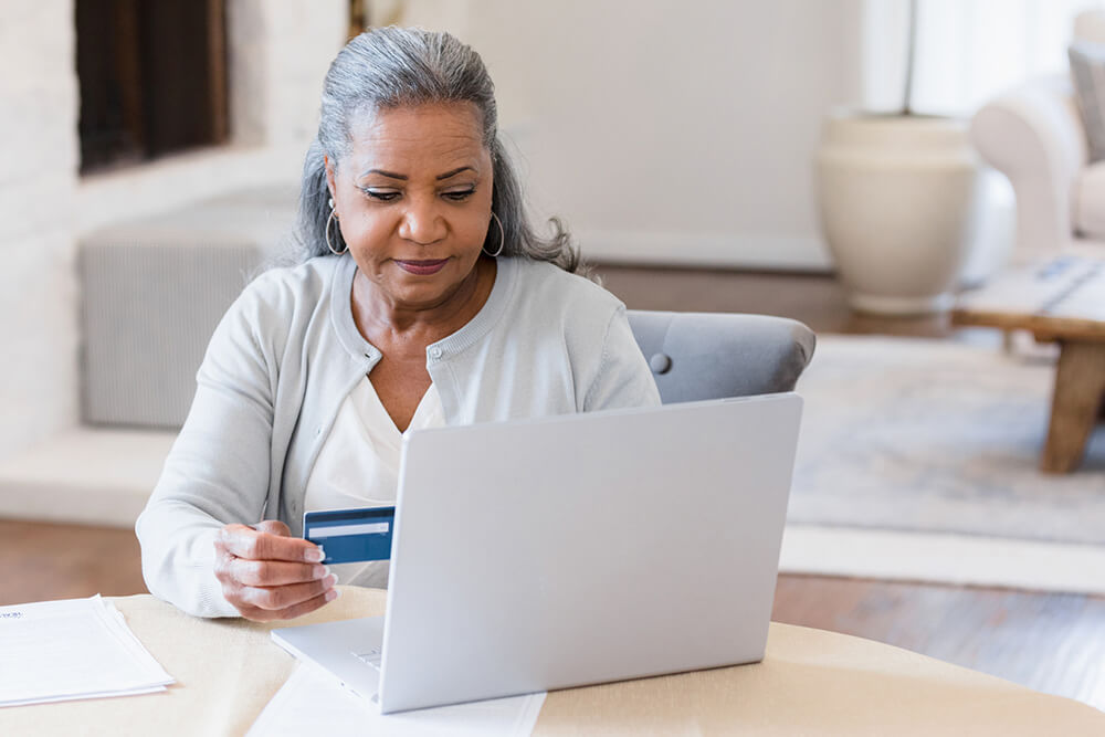 woman entering credit card information on website