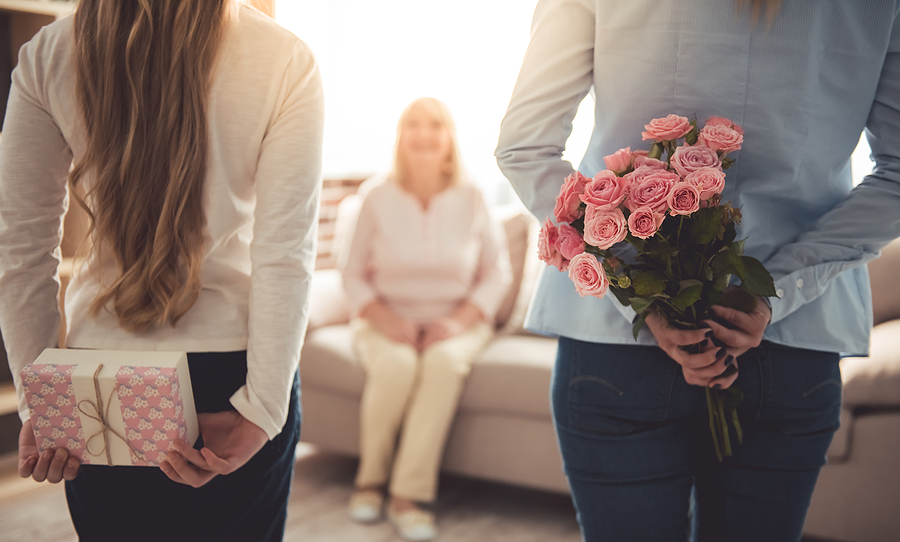 Daughter and granddaughter surprising a loved one with presents