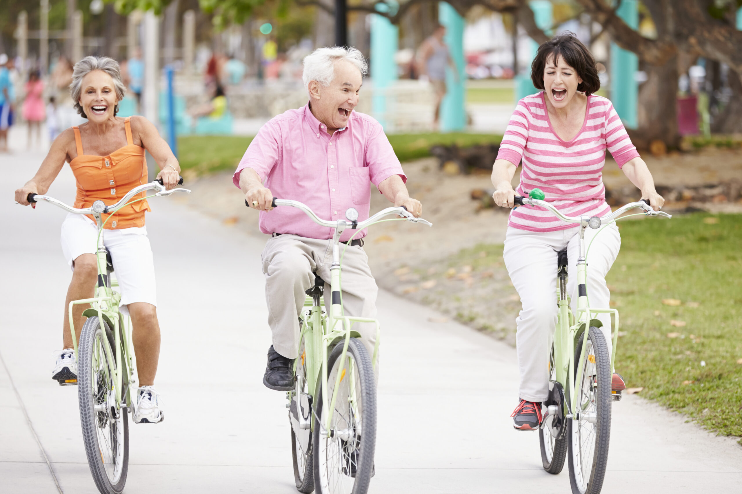 Group of seniors biking on a bike path