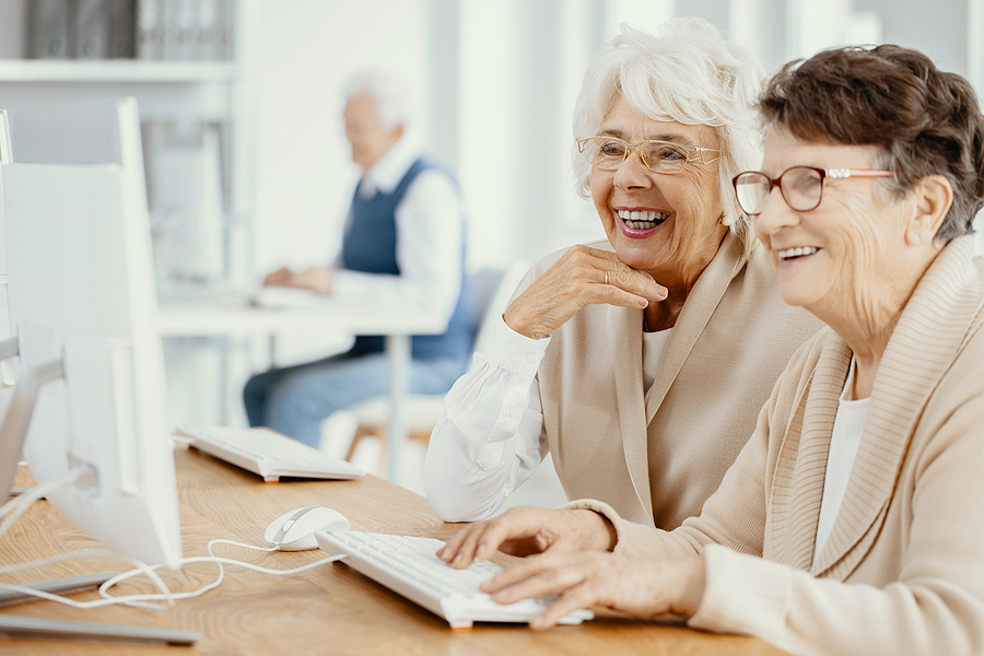 Two senior women participate in some digital education programs for seniors