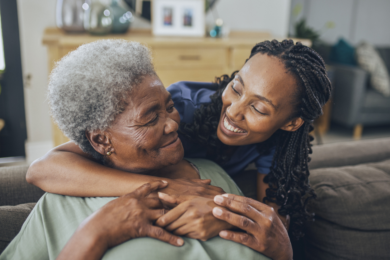 Senior woman embracing daughter